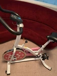 Sunny Health Fitness P8100 Chain Drive Indoor Exercise Bike - Pink. Fixed Price $35.00.