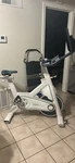 Myx Stationary Fitness Bike Color White. Fixed Price $450.00.